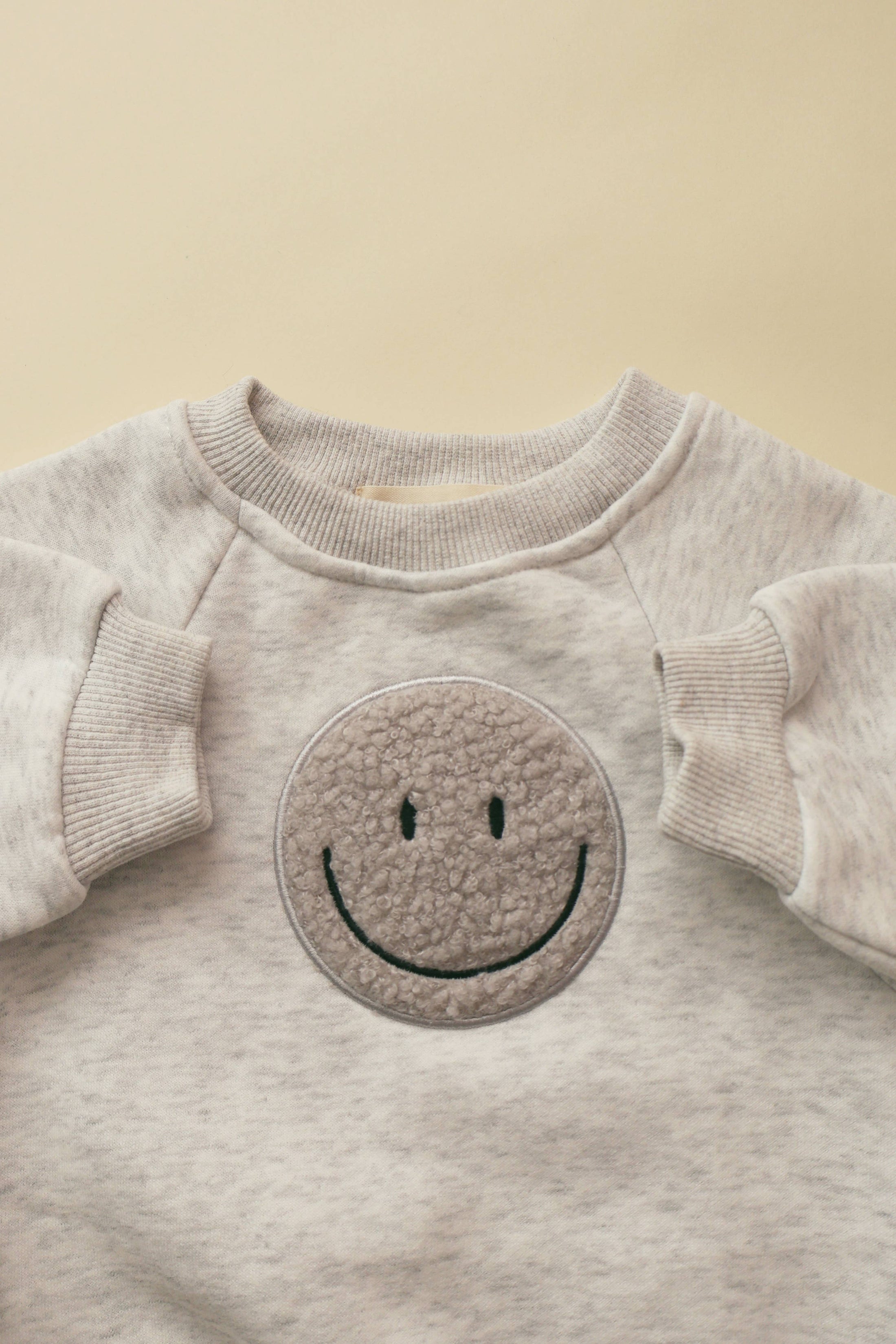 Sherpa Smiley Bubble Onesie