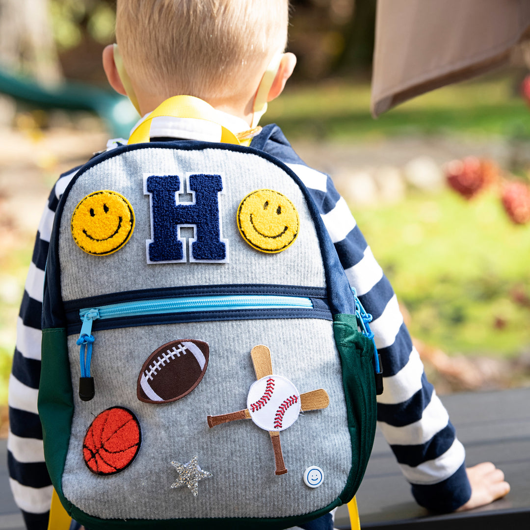 Model Using Becco Bags Small Becco Backpack - Kids Lux Navy/Hunter