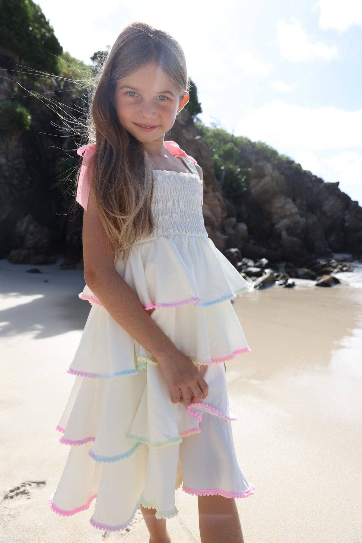 Model Wearing Lola and the Boys Rainbow Tiered Bow Dress