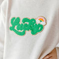 Load image into Gallery viewer, Sweet Wink model wearing Lucky Rainbow Patch St. Patrick's Day Sweatshirt - Natural
