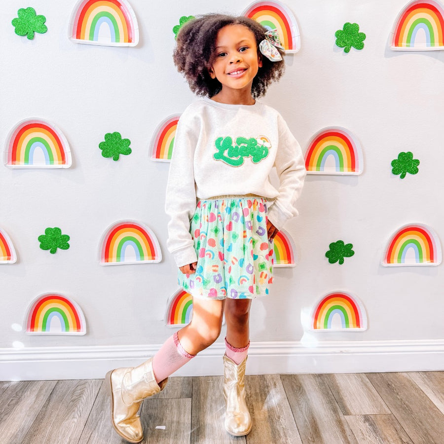 Sweet Wink model wearing Lucky Rainbow Patch St. Patrick's Day Sweatshirt - Natural