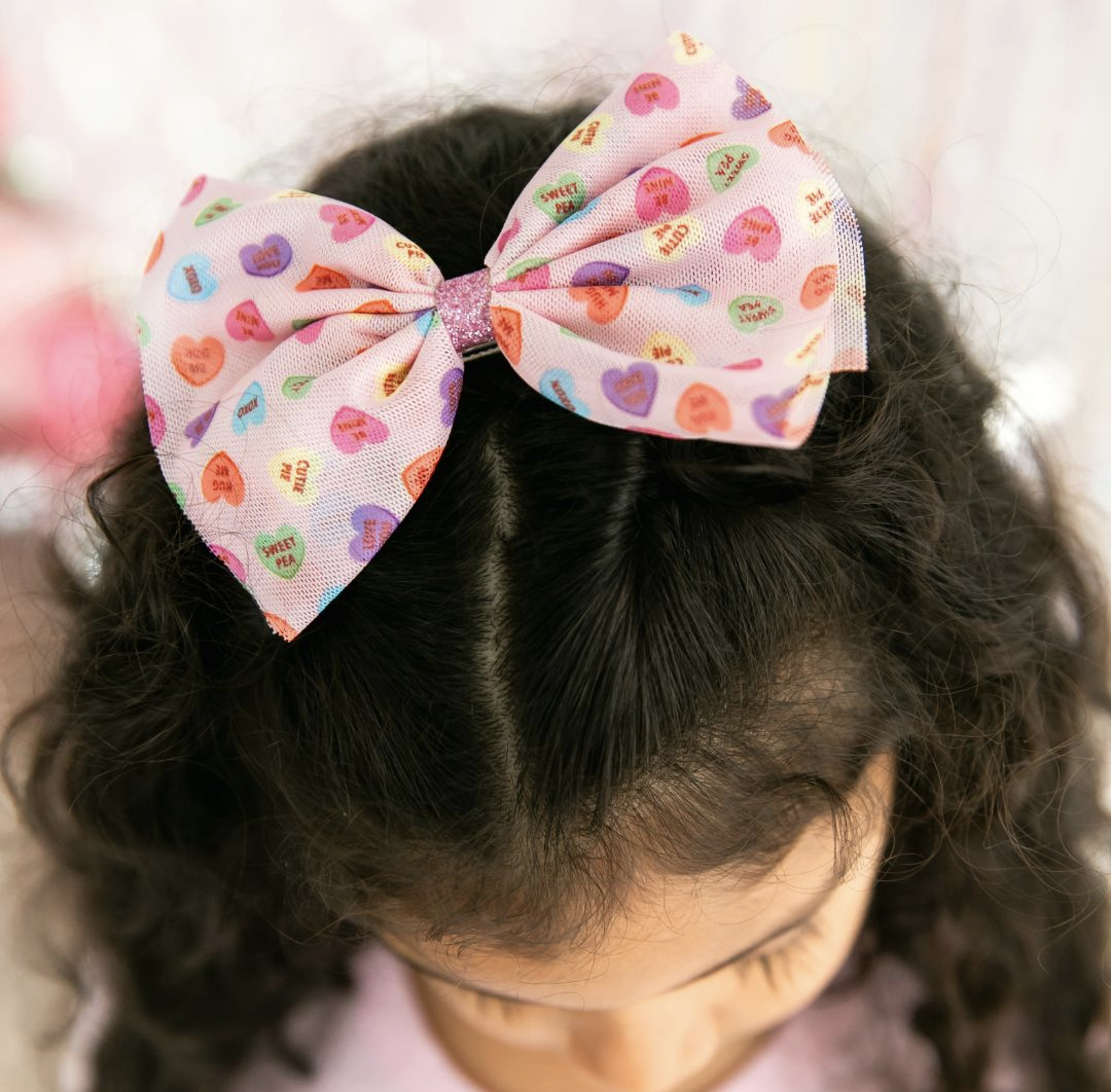 Model Wearing Sweet Wink Candy Hearts Valentine's Day Tulle Bow Clip