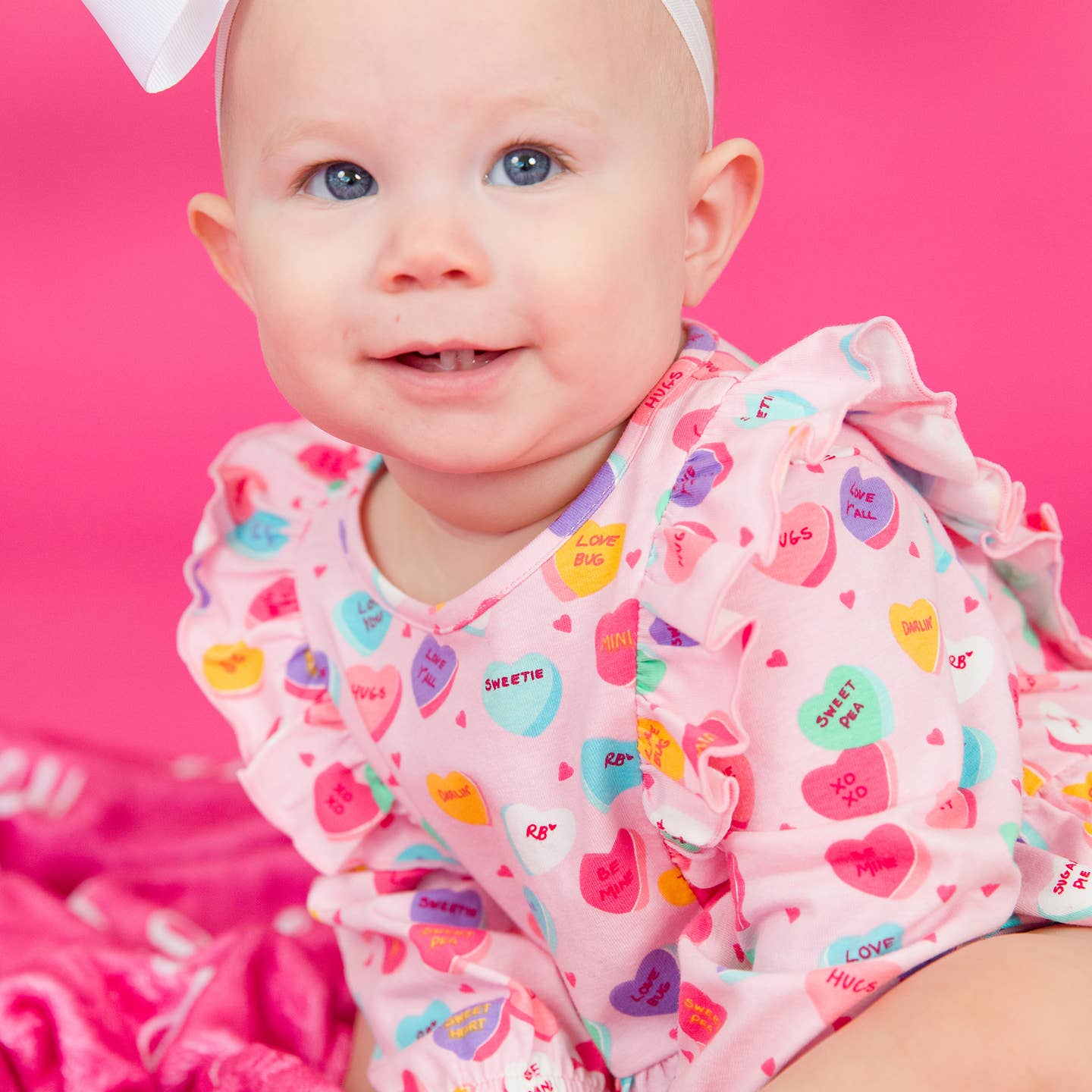 Model Wearing Rufflebutts + Ruggedbutts Baby Girls Be My Valentine Knit Long Sleeve Waterfall Bubble Romper